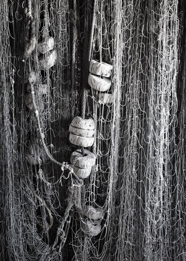 https://thumbs.dreamstime.com/b/vertical-hanging-fishing-nets-cork-floats-black-white-close-up-stored-net-multiple-vintage-cord-strung-secured-128721354.jpg