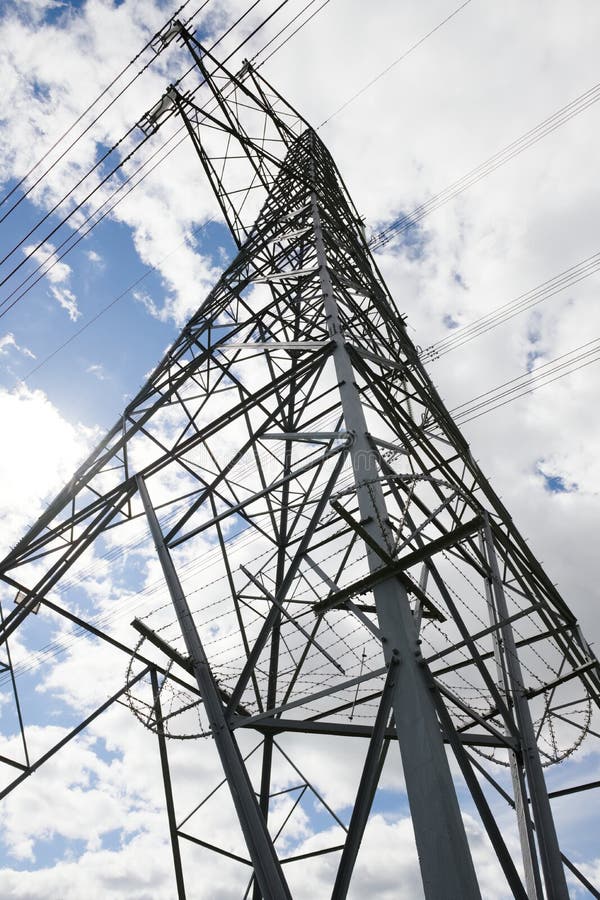 Vertical image of the converging lattice work of an electrical pylon stock photo
