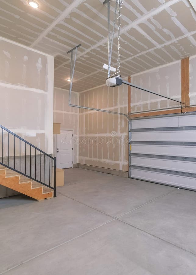 Vertical Interior of an Unfinished Garage with Automatic White