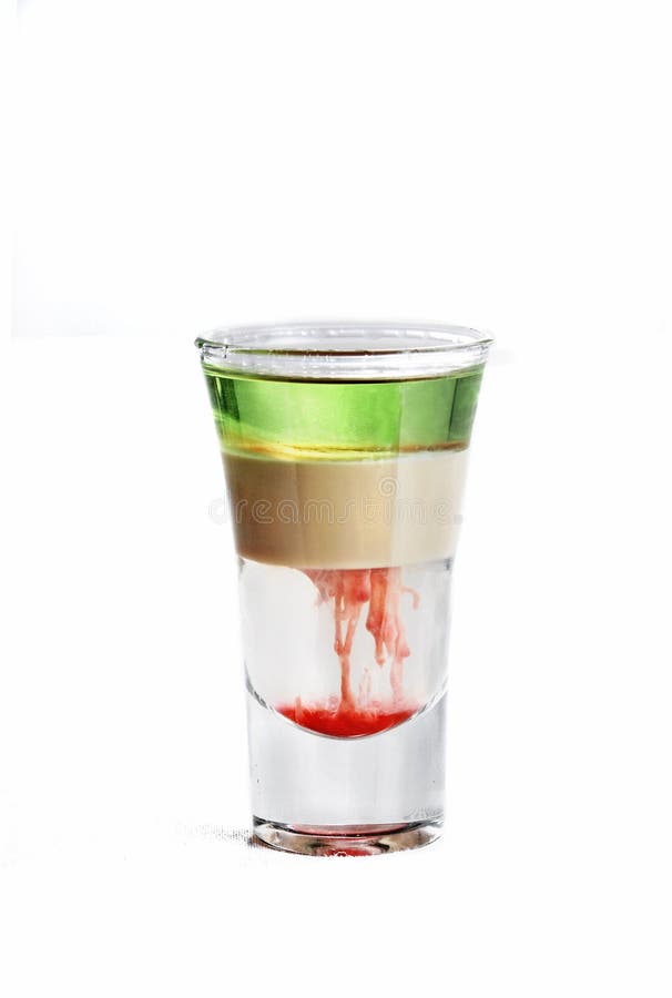 Vertical isolated shot of a multi-colored cocktail in a vodka glass - perfect for menu usage stock images Vertical isolated shot of a multi-colored cocktail in a vodka glass - perfect for menu usage stock images