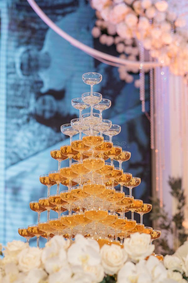 Vertical Low Angle Shot of a Champagne Tower, Glasses Filled with