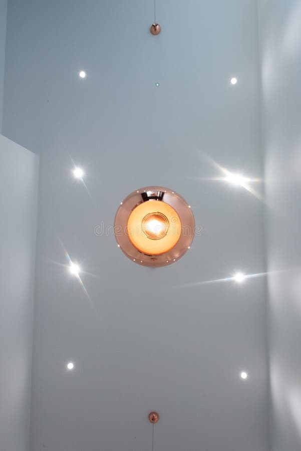 Vertical Low Angle Shot of Light Fittings on the Ceiling with Bright