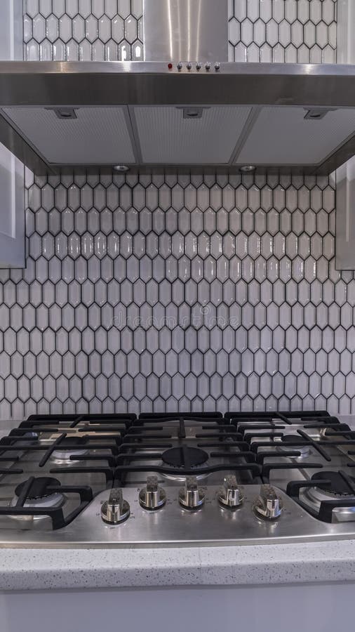 Vertical Modern Gas Cooker Hob Under an Extractor Fan Stock Image