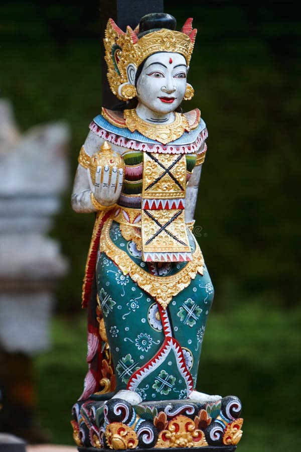 Vertical photo of beautiful Balinese statue royalty free stock photography