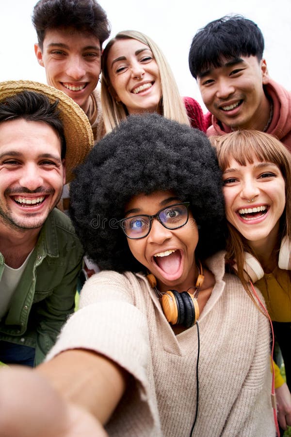 Vertical Photo Of Cheerful Group Of Friends Taking Smiling Selfie 