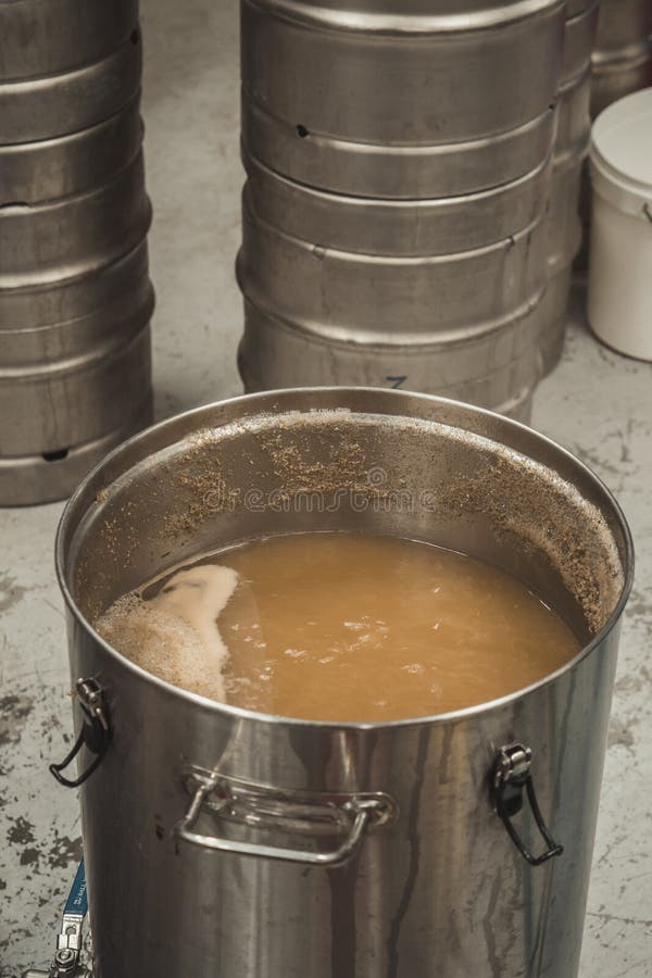 Vertical Shot of the Beer Brewing Process with Boiling the Wort Stock
