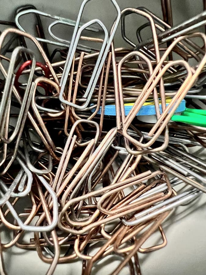 Vertical shot of a bunch of paper clips stock photo
