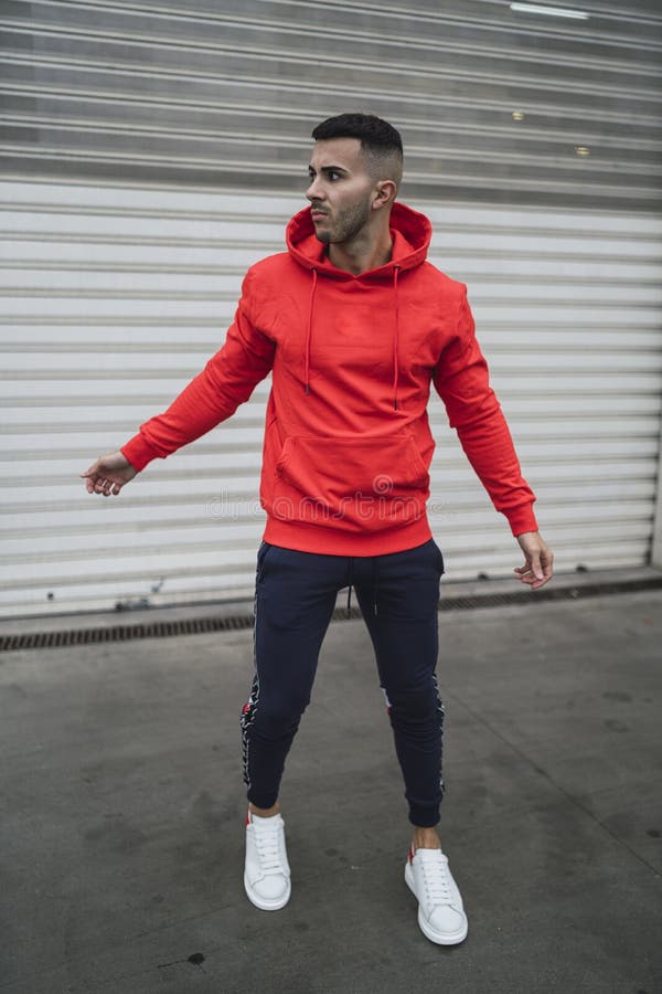 Vertical Shot of a Cool Young Man Wearing a Hoodie and Sweatpants ...