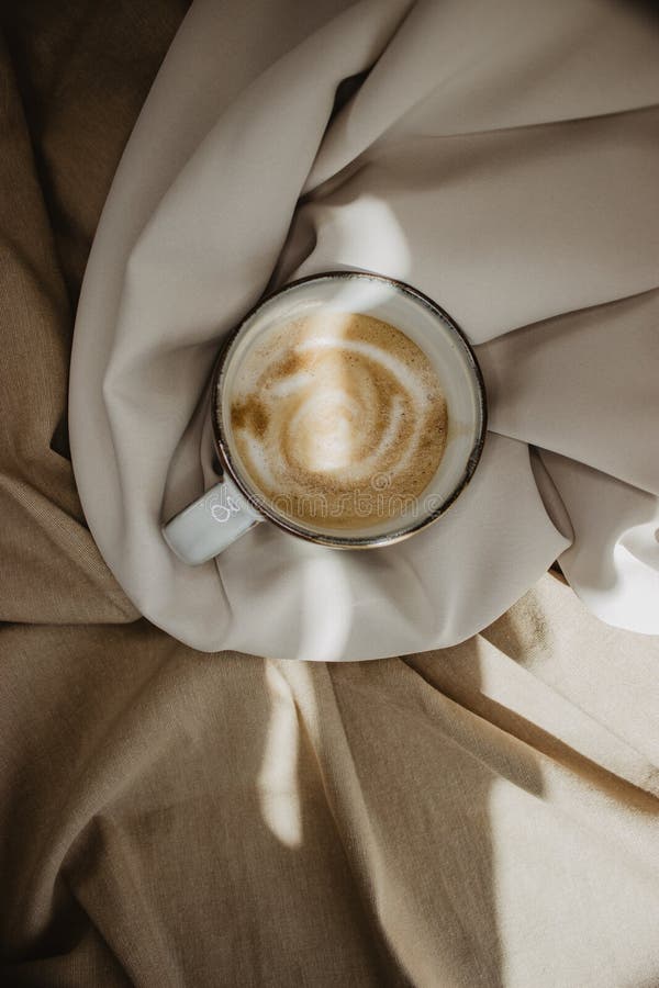 Vertical Shot of a Cup of Foamy Coffee on a Fabric Surface Stock Photo Image of natural, drink