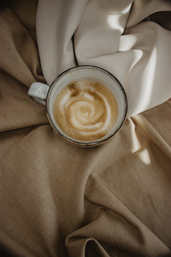 Vertical Shot of a Cup of Foamy Coffee on a Fabric Surface Stock Image Image of foamy