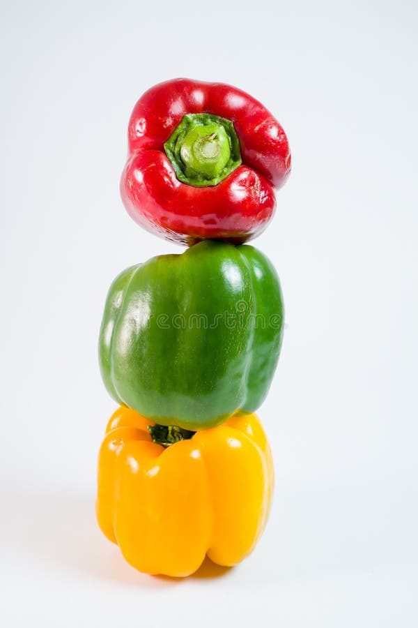 Vertical shot of fresh bell pepper stacked together stock photos Vertical shot of fresh bell pepper stacked together stock photos
