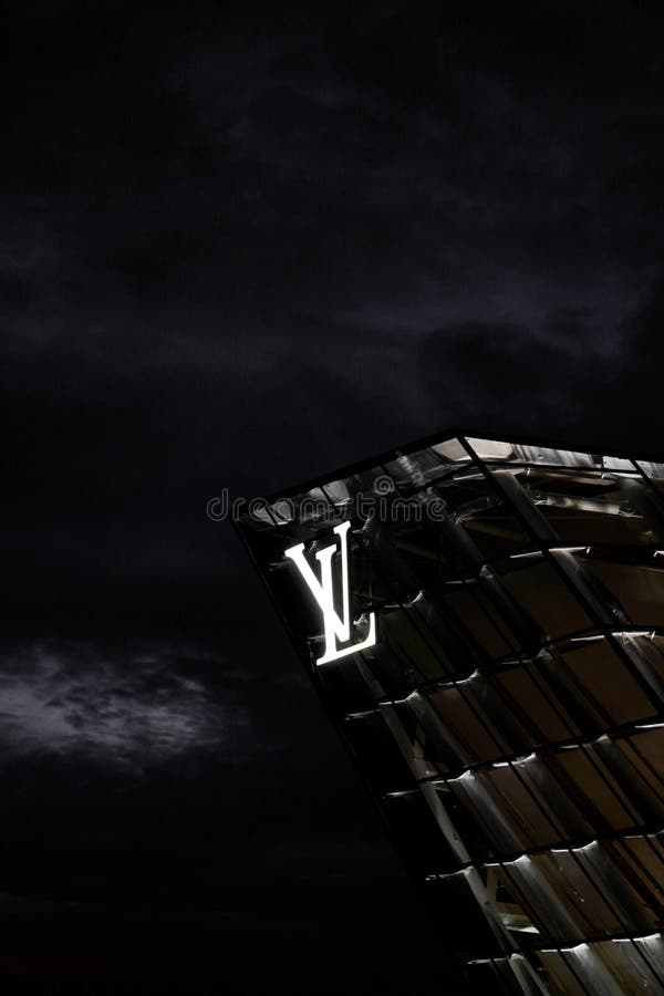 Street Signage Board with Louis Vuitton Logo in the Evening. Blurred  Business District Skyscrapers Background Editorial Image - Image of  evening, banner: 85967980