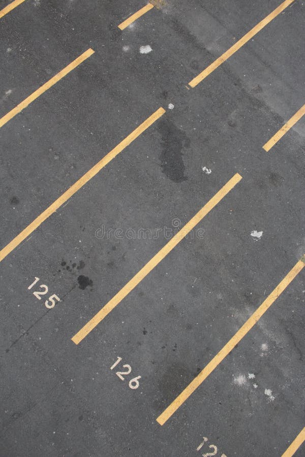 Vertical Shot of a Parking Lot with Numbers and Yellow Lines Stock