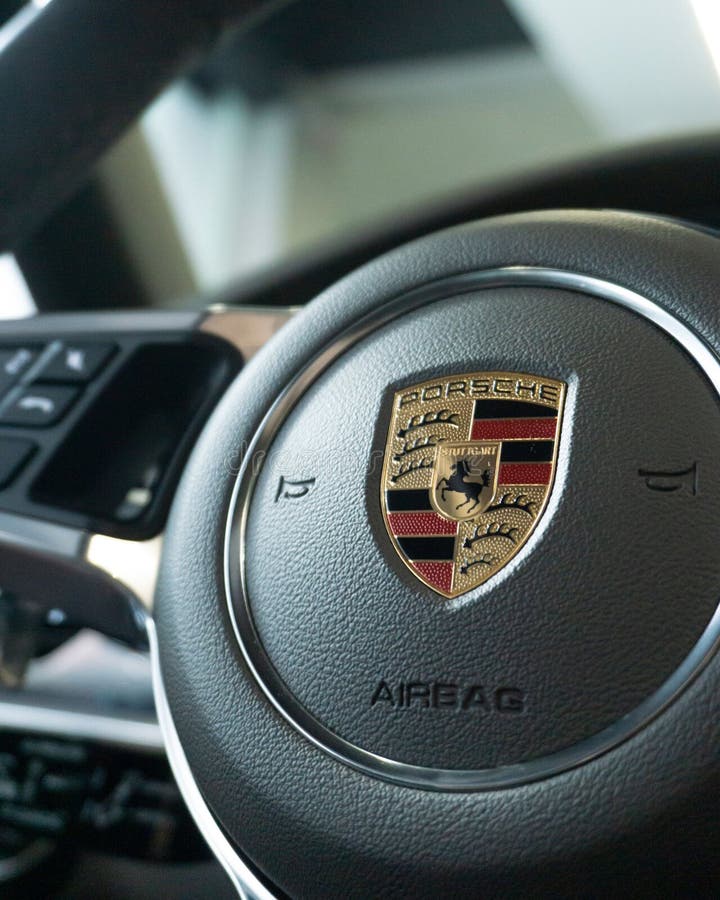 Vertical Shot of a Porsche Panamera Steering Wheel Badge Editorial