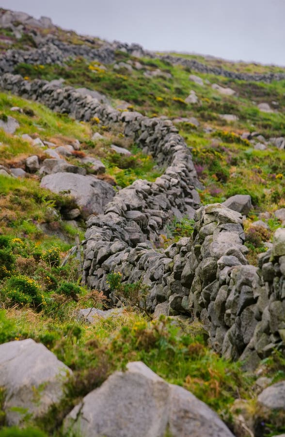 Vertical shot of Rock Wall in Northern Ireland stock photos Vertical shot of Rock Wall in Northern Ireland stock photos