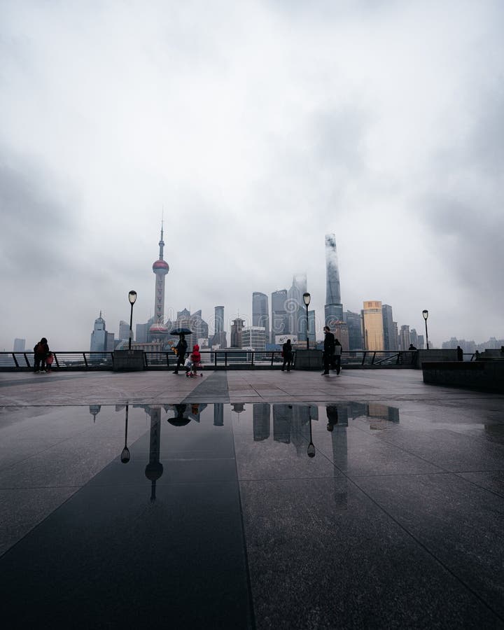 Vertical shot of the Shanghai skyline with tall modern buildings during the rain stock photos