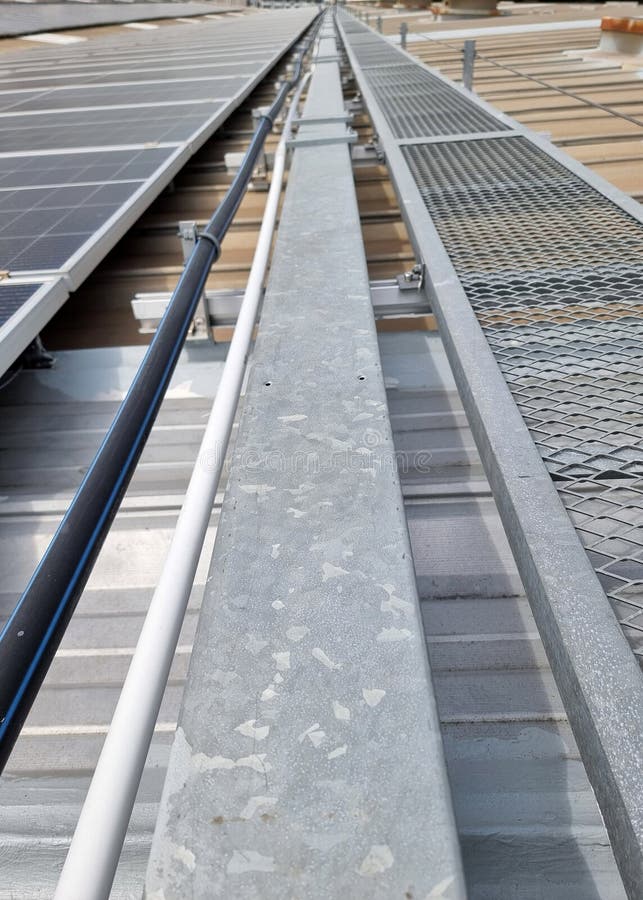 Vertical shot of Solar rooftop system installation. royalty free stock images