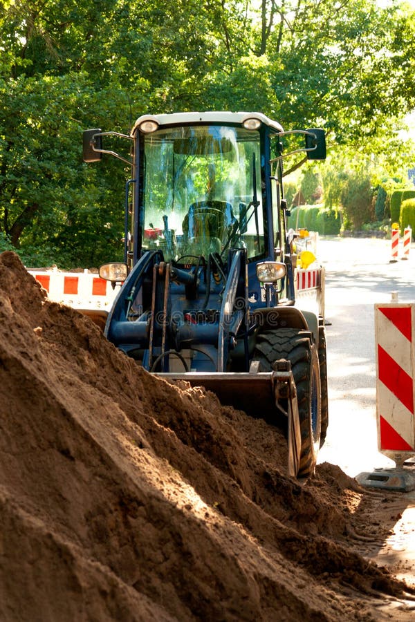 Vertical Shot of the Tractor on a Construction Land Stock Image Image