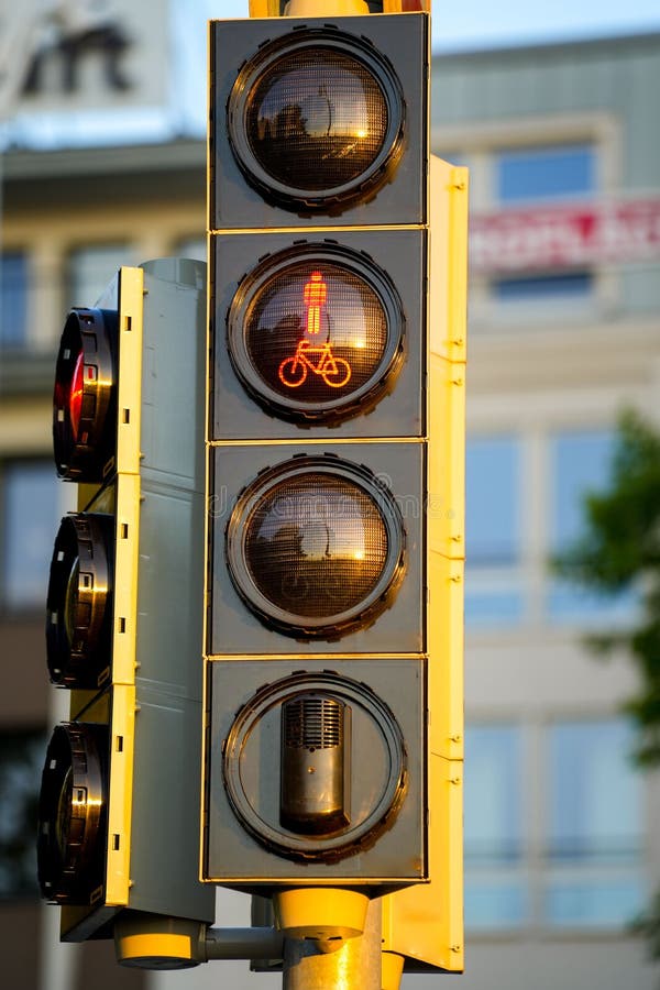 Vertical Shot of a Traffic Light with Red for Cyclists Stock Photo