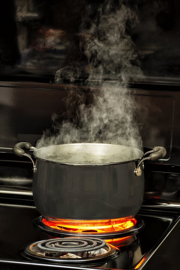 Steaming Pot Of Boiling Water On Red Hot Electric Stove Burner Stock Photo  - Download Image Now - iStock