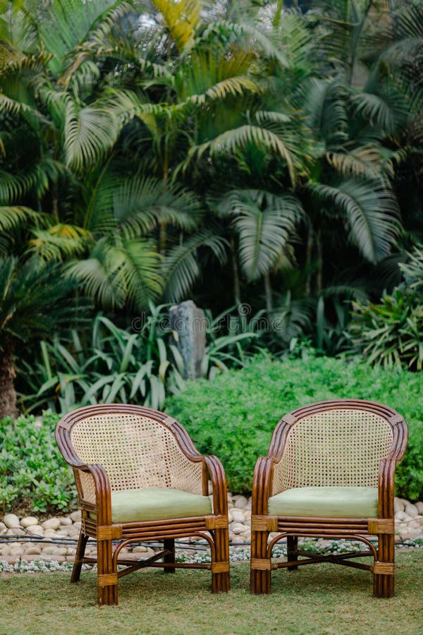 Vertical of Small Chairs with Beautiful Design in a Garden Stock Image