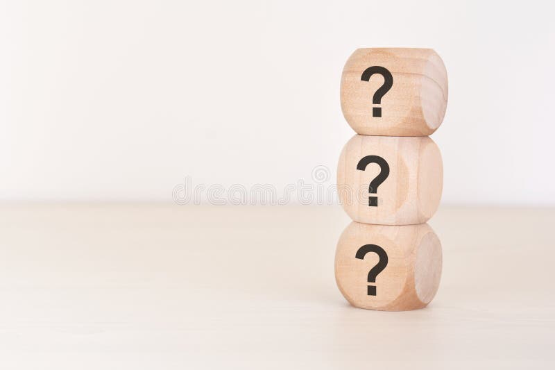 Vertical stack of wooden cubes with question mark symbols, FAQ concept. Conceptual pair with exclamation mark available in stock images