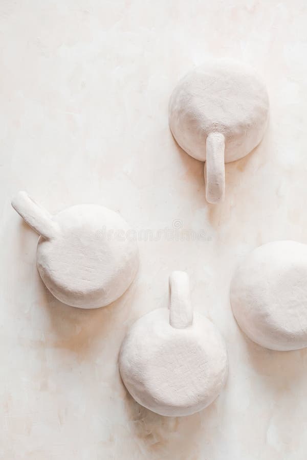 Vertical Top View of Small Handmade Crafts Beige Clay Pottery Cups with