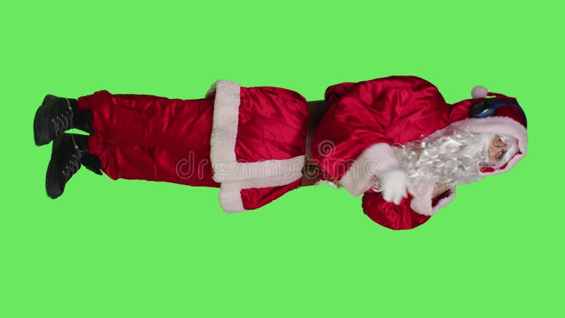 Vertical video Side view of saint nick having fun with music stock video