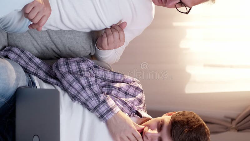 Vertical supportive father laptop lesson help stock video footage