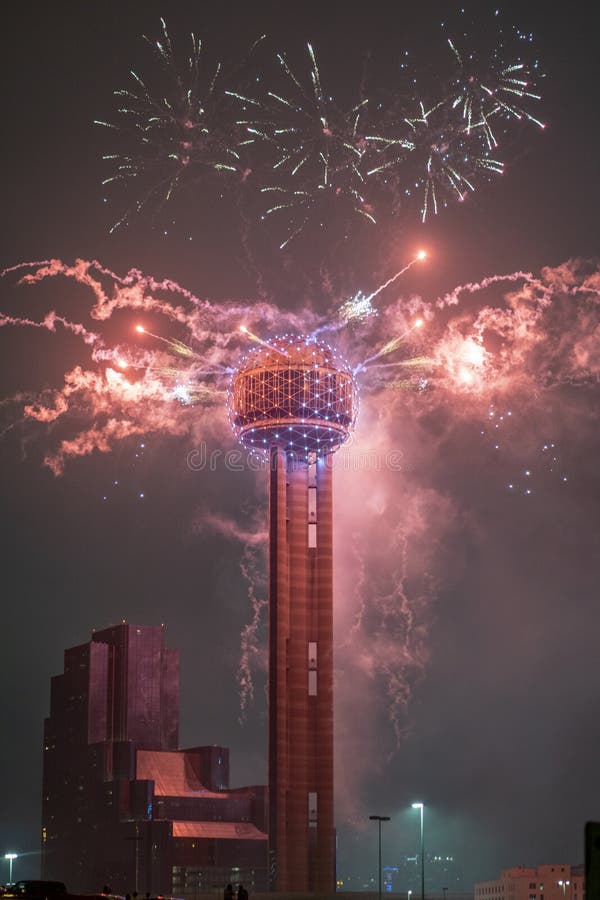 Vertical View of Colorful Fireworks Exploding Above the Reunion Tower
