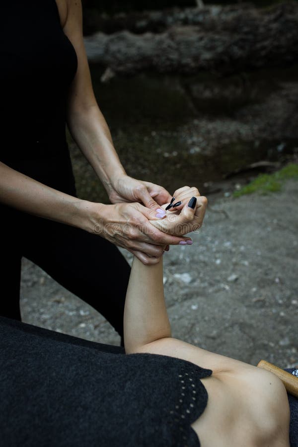 Vertical View of a Relaxing Hand Massage Healing the Arm Injury Stock
