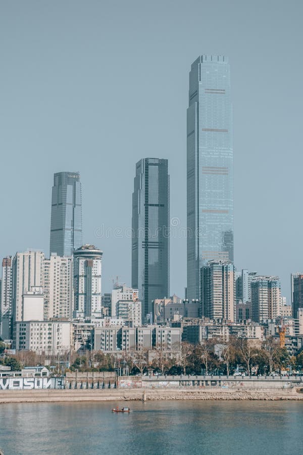 Vertical view of waterside buildings in Changsha before a blue skyline royalty free stock photos