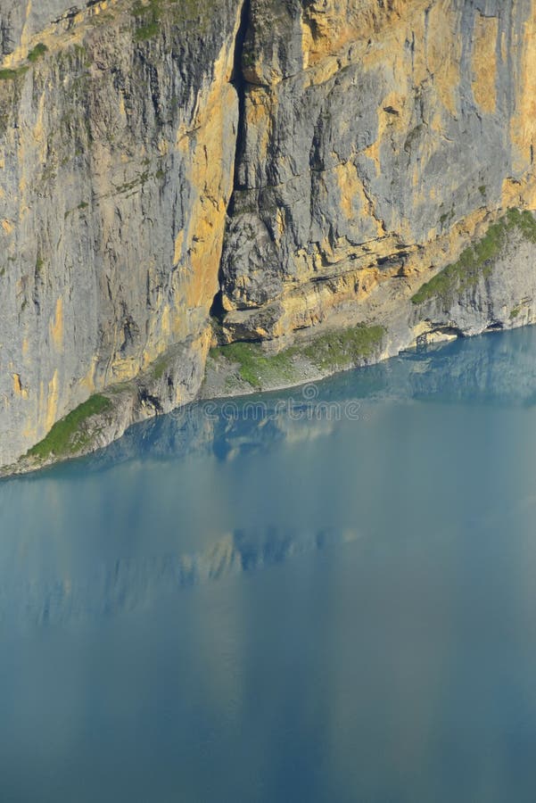 Vertical wall and Oeschinensee. Kandersteg. Berner Oberland. Switzerland