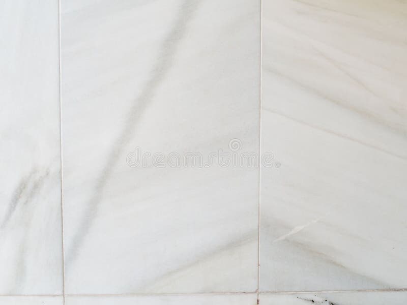 Vertical White Marble on a Wall. Marble Tiles Textures Stock Image