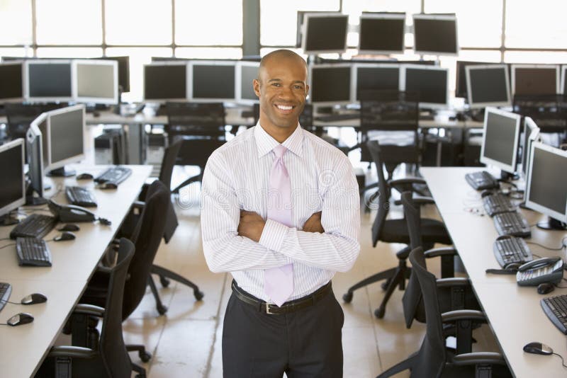 Portrait Of A Male Stock Trader Smiling With Crossed Arms. Portrait Of A Male Stock Trader Smiling With Crossed Arms