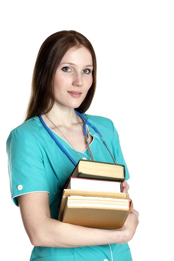 Portrait of female doctor in the green uniform with books. Portrait of female doctor in the green uniform with books