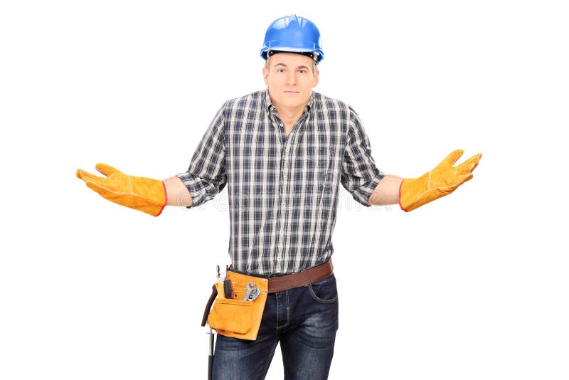 Verwirrter männlicher Ingenieur, der mit den Händen gestikuliert stockfotografie