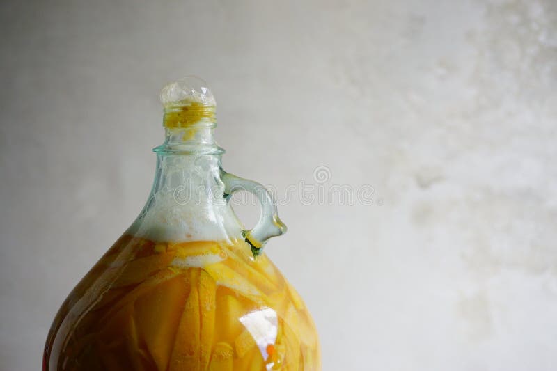 Very Active Fermentation of Organic Peach Wine or Mead in a Glass