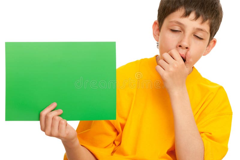 A boy is holding a sheet of green paper; isolated on the white background. Boring kid white stock images, royalty-free photos and pictures
