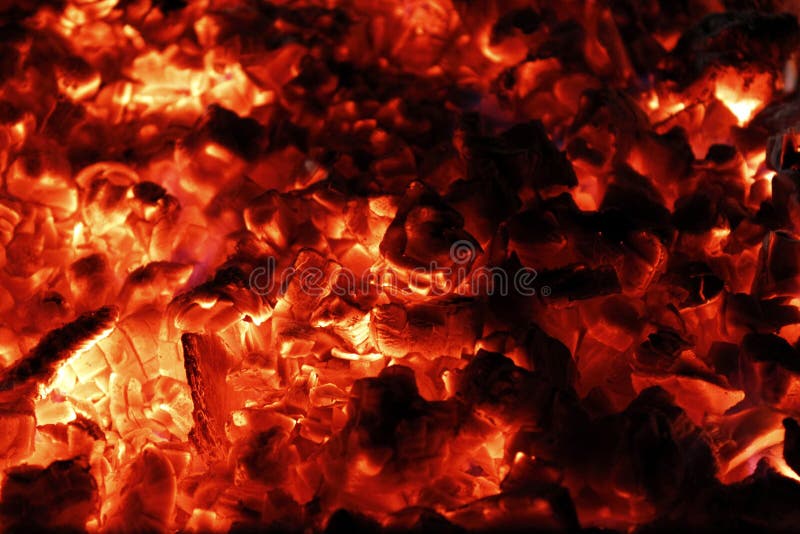 Very hot smouldering embers in the grill. Fire background for bbq