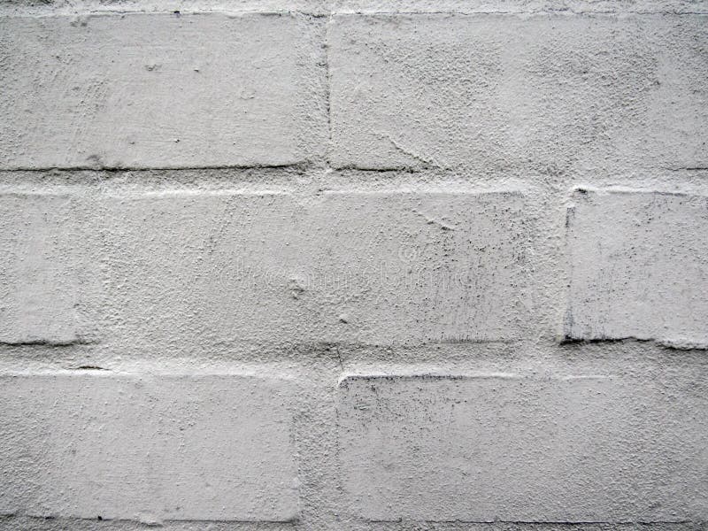 Painted White Bricks Wall with Weathered Layers of Paint Stock Image