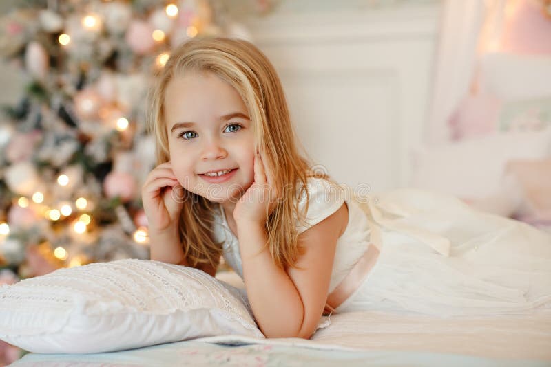 Very Nice Charming Little Girl Blonde in White Dress Lying on Th Stock ...