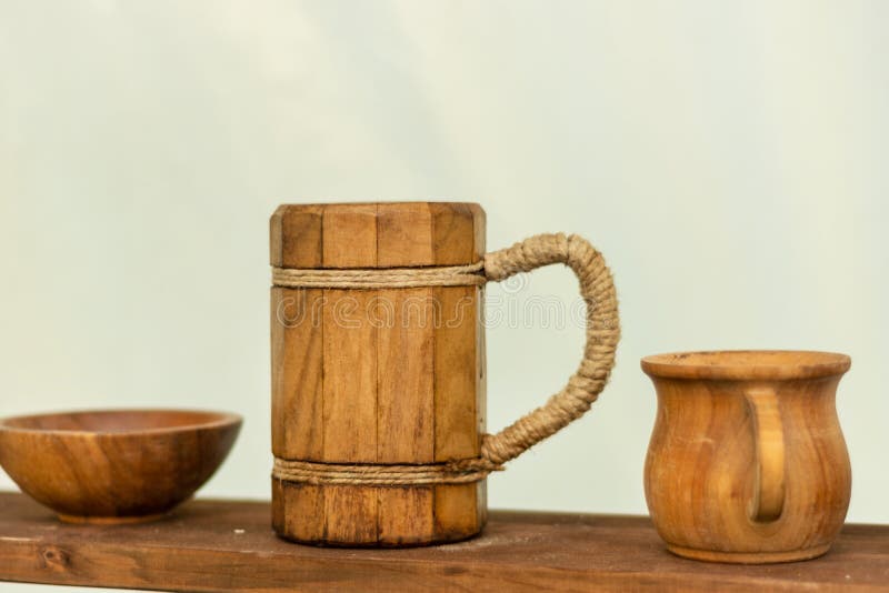 Medieval wooden beer mug on the wooden shelf stock photography Medieval wooden beer mug on the wooden shelf stock photography