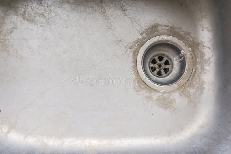 Very old dirty sink with rusty metal drain stock image Very old dirty sink with rusty metal drain stock image