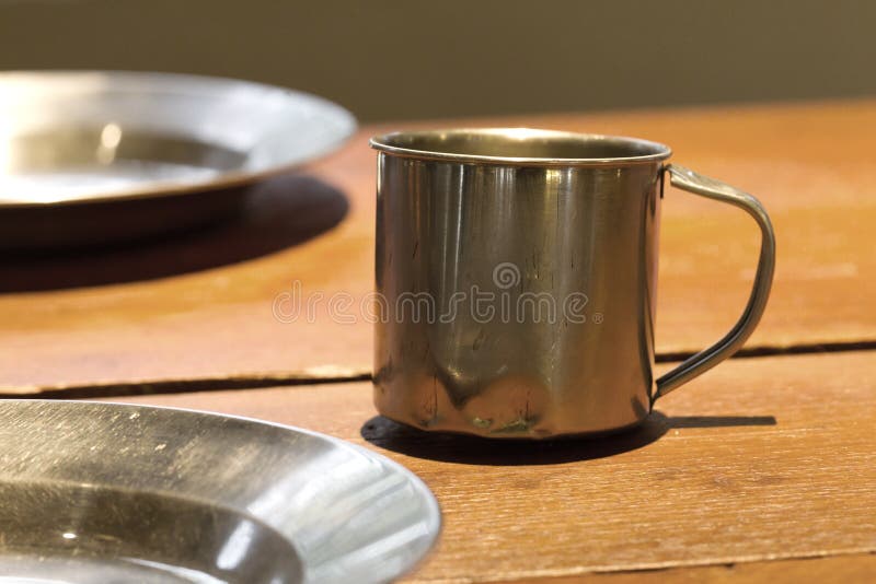 Very Old Metal Cups and Plates on a Wooden Table Stock Image Image of