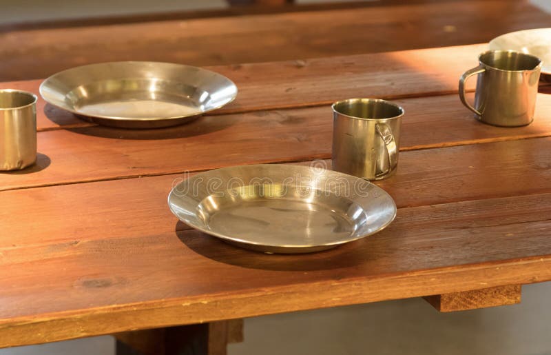 Very Old Metal Cups and Plates on a Wooden Table Stock Image Image of