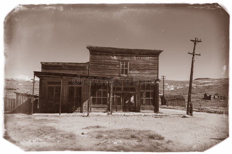 Very old sepia vintage photo with abandoned western saloon building in the middle of a desert