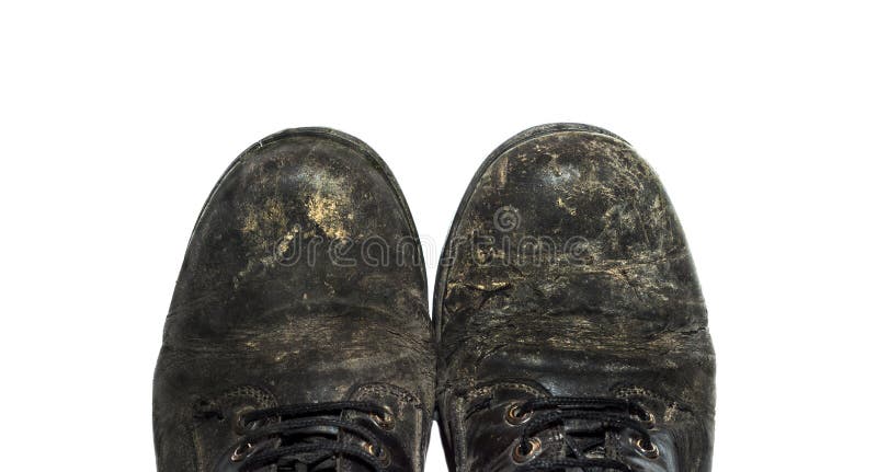 Very old pair of black shoes on white background. Very old pair of black shoes on white background