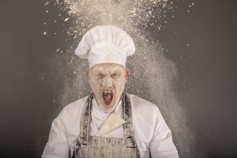 Verärgerter Chef, der in einer Mehlwolke schreit stockfotos Verärgerter Chef, der in einer Mehlwolke schreit stockfotos