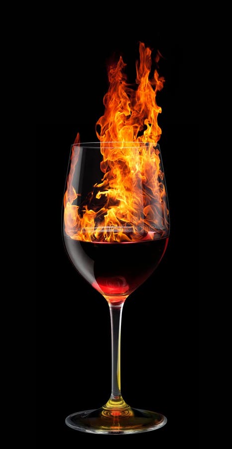 Vetro di bruciatura del vino rosso fotografie stock Vetro di bruciatura del vino rosso fotografie stock